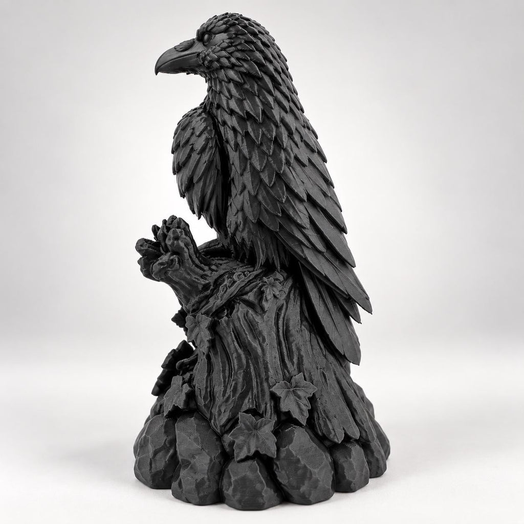 Side view of the raven figurine showing talons gripping the branch