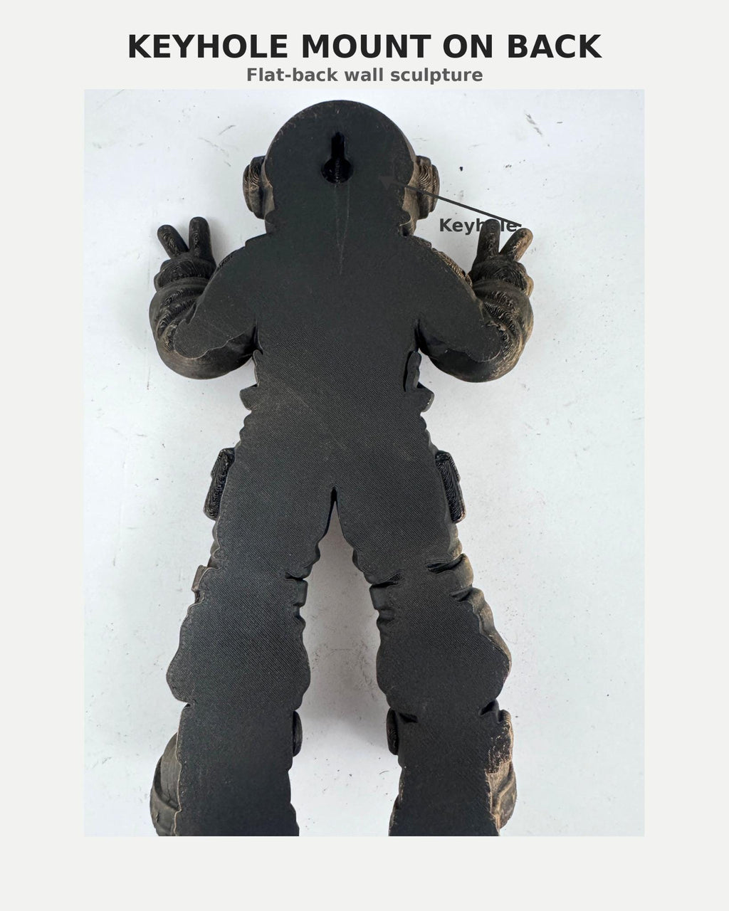 Back of the astronaut sculpture showing the keyhole mount