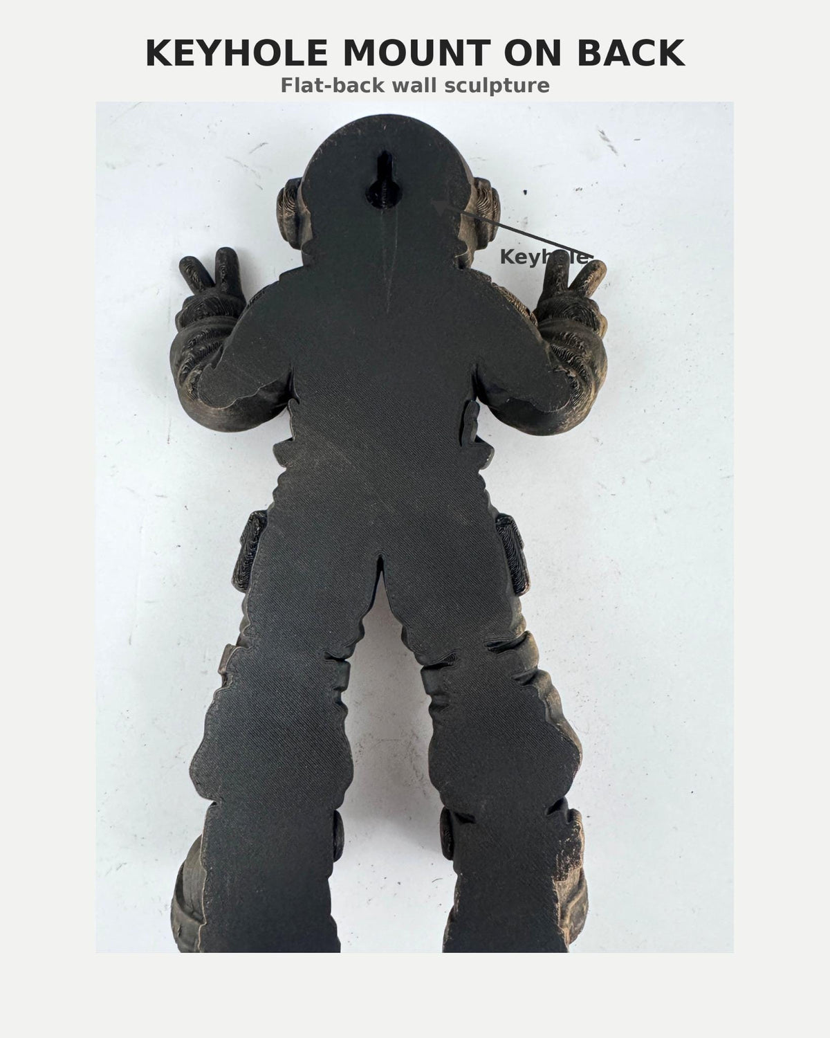 Back of the astronaut sculpture showing the keyhole mount