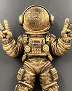 Close-up of the astronaut's helmet, chest pack and peace-sign hands