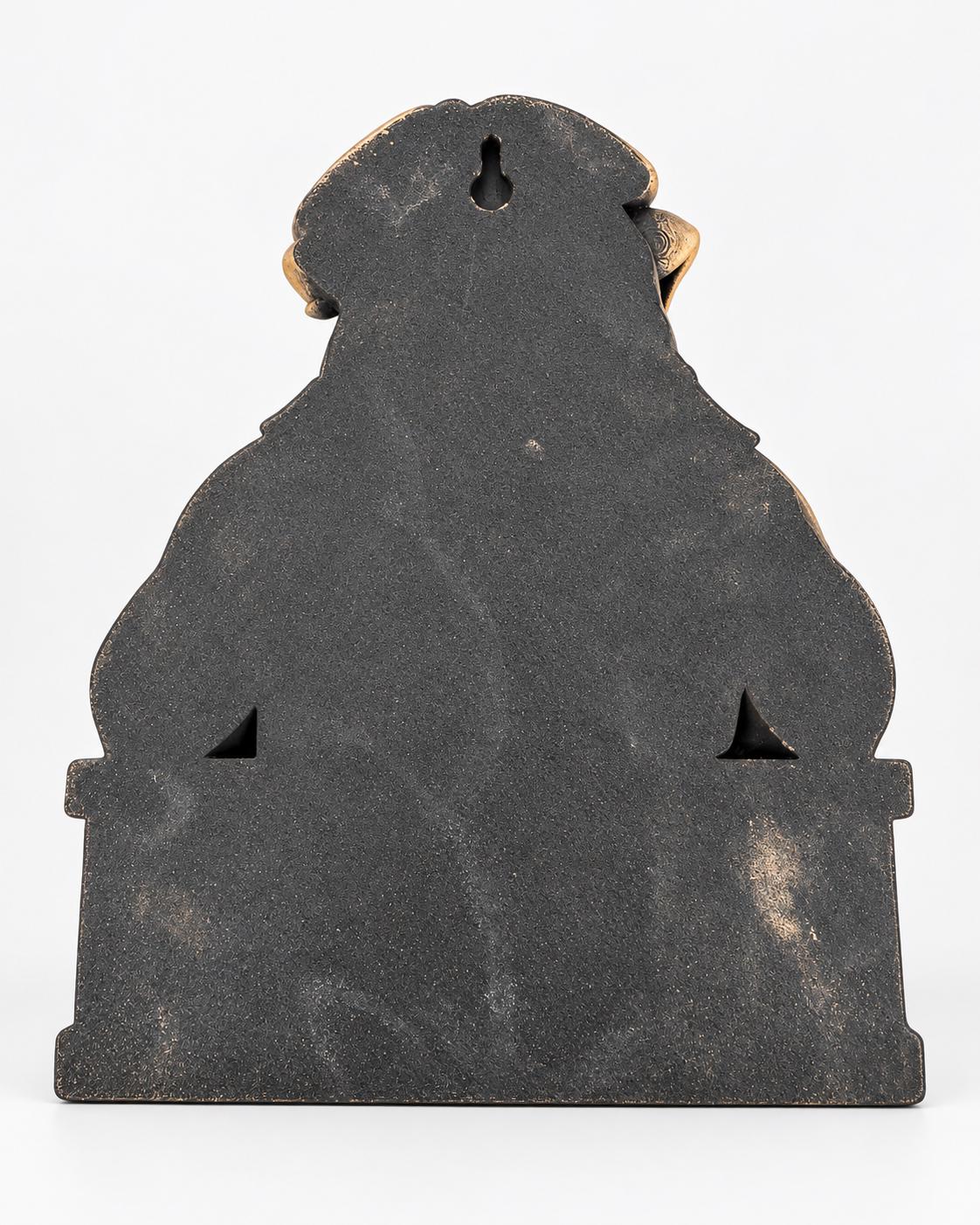 Back of the bulldog sculpture showing the keyhole mount