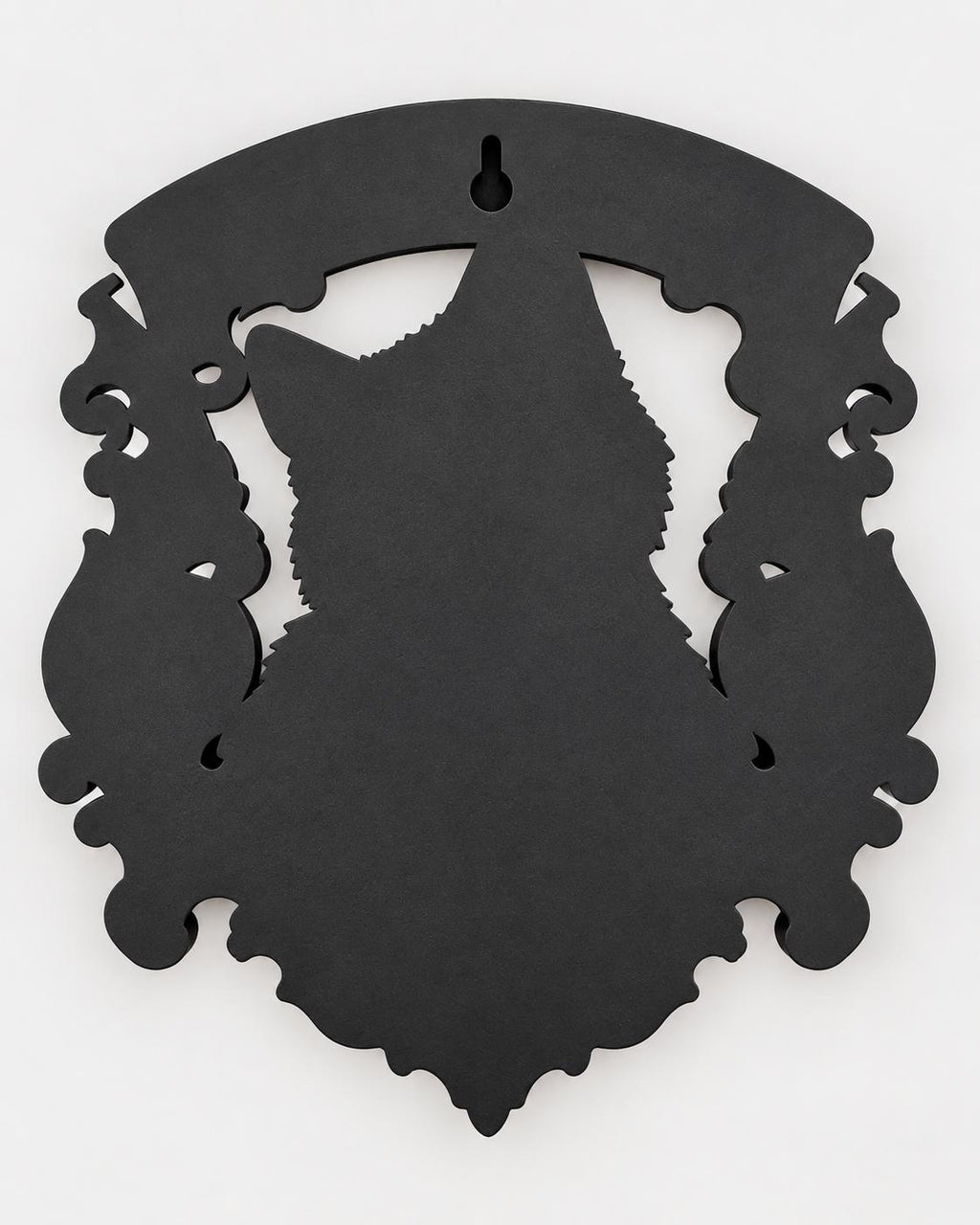 Back of the cat memorial plaque showing the keyhole slot