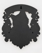 Back of the cat memorial plaque showing the keyhole slot
