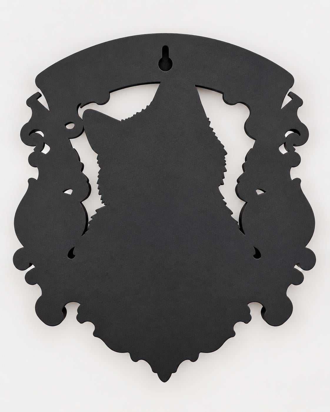 Back of the cat memorial plaque showing the keyhole slot