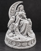Front angle of the moon goddess holding an orb with an owl at her side
