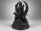 Angled view of the black Hecate goddess between two seated hounds