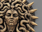 Close-up of Medusa's face, scaled serpents and throat pendant