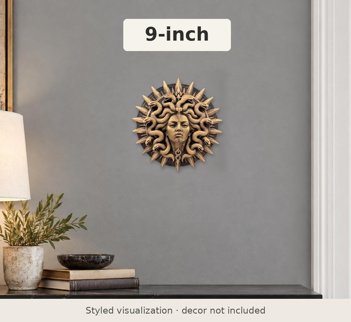 Styled view of the 9 in. Medusa medallion on a gray wall above a console