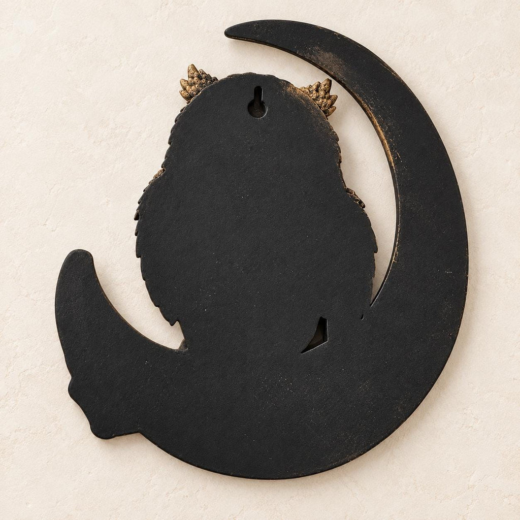 Back of the owl moon sculpture showing the keyhole slot