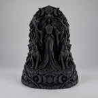 Front view of the black Hecate goddess under a triple moon arch