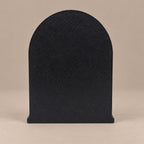 Back of the Lilith statue showing the plain flat arched back