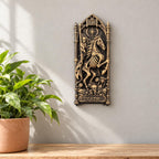 Death tarot wall relief hung beside a potted plant on a wooden shelf