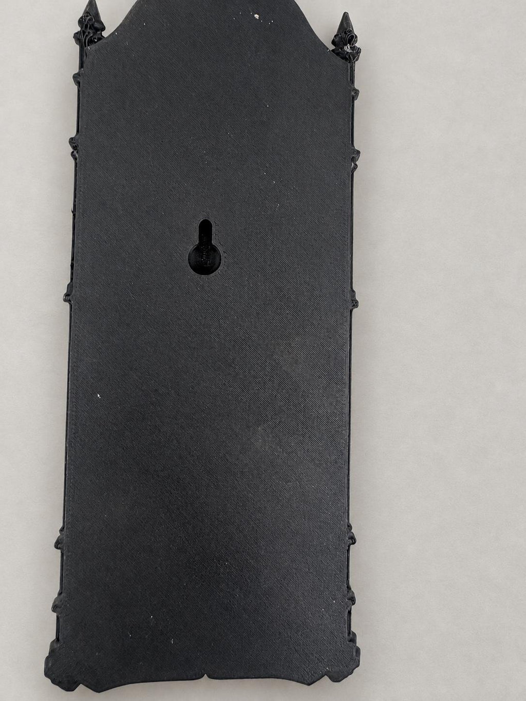 Back of the Death XIII relief showing the recessed keyhole mount