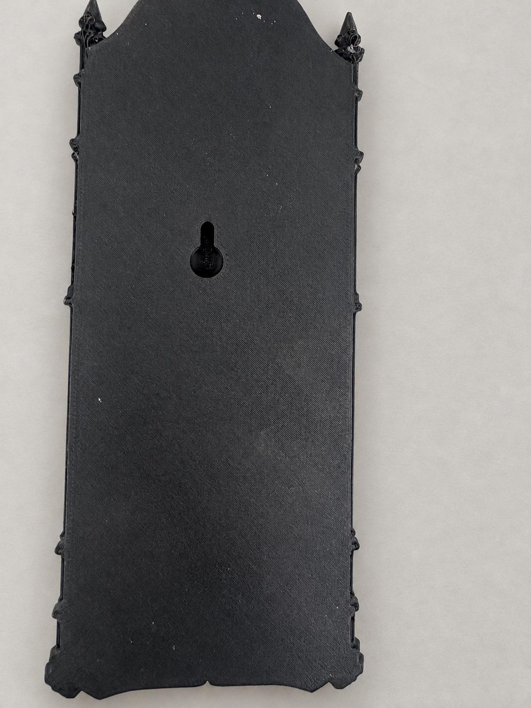 Back of the Death XIII relief showing the recessed keyhole mount