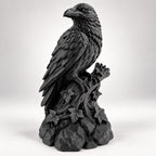 Front angle of the black raven statue showing layered feathers and beak