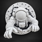 Front view of speckled white astronaut climbing out of a cratered moon wall sculpture
