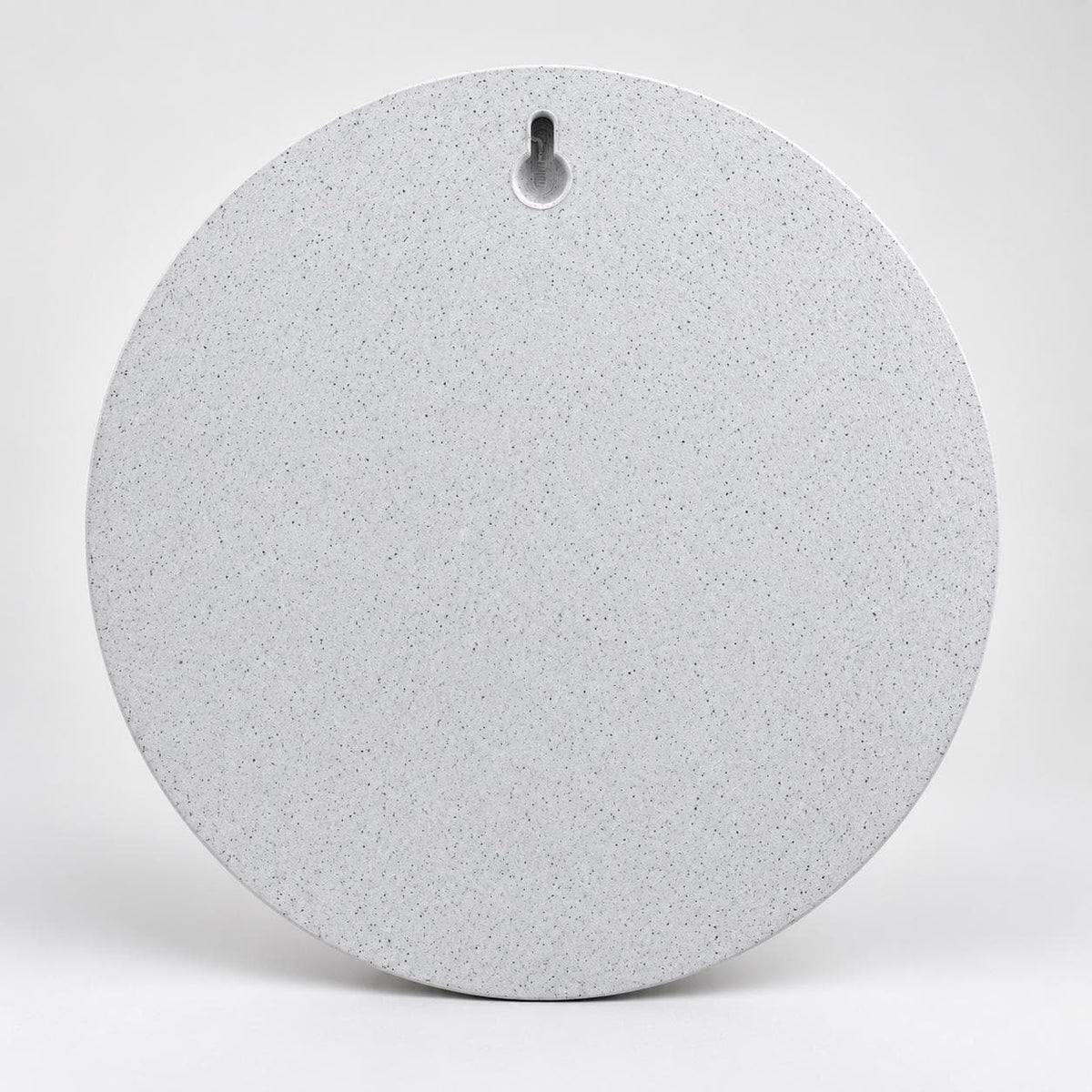 Back of the round moon sculpture showing the keyhole slot