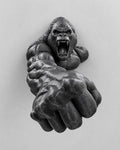 Front view of black roaring gorilla wall sculpture reaching out with a huge fist