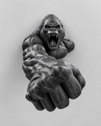 Front view of black roaring gorilla wall sculpture reaching out with a huge fist