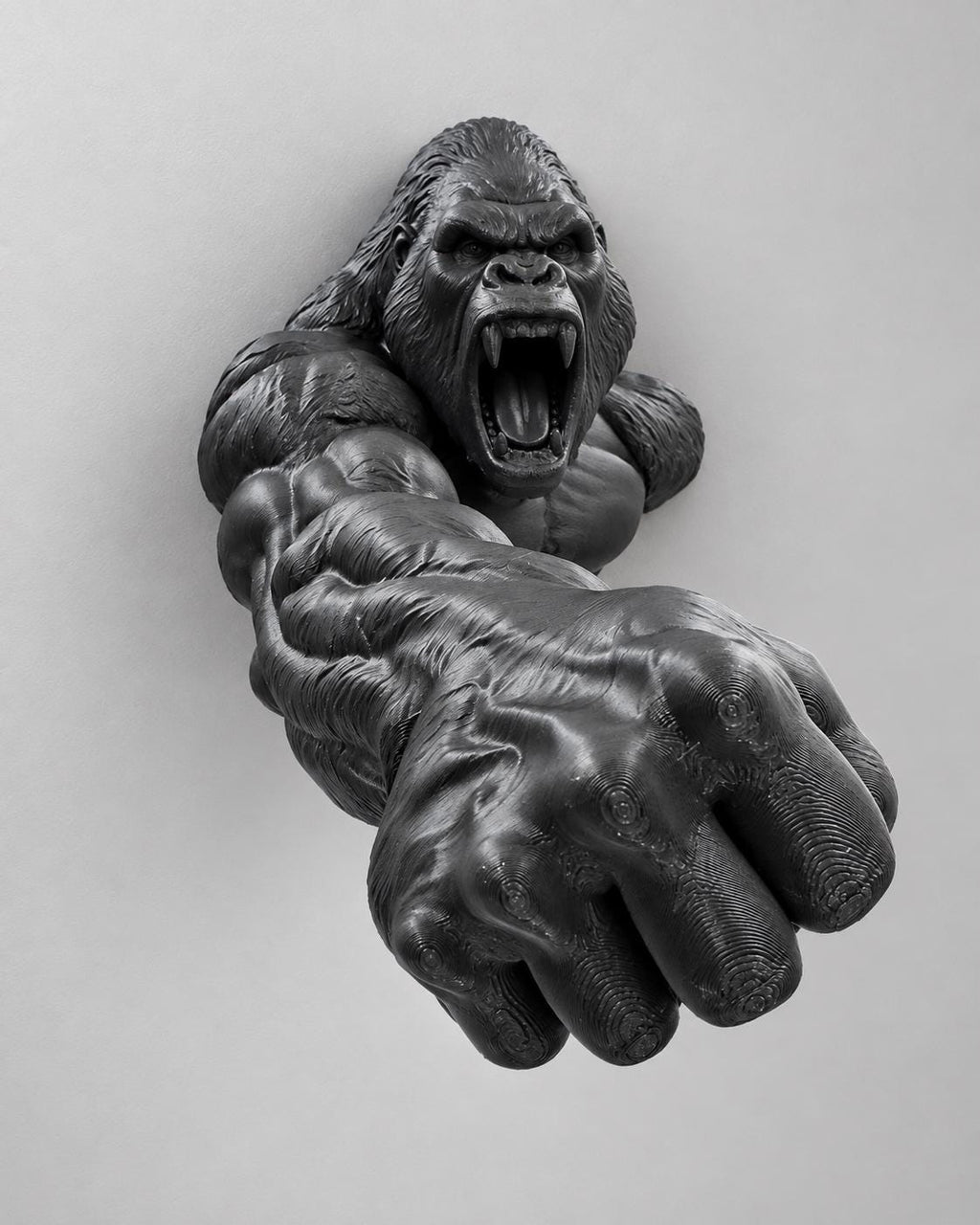 Close front view of the roaring gorilla's open mouth and outstretched hand
