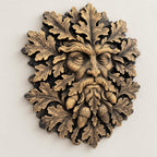 Close-up of sculpted oak leaves and acorns on the Green Man