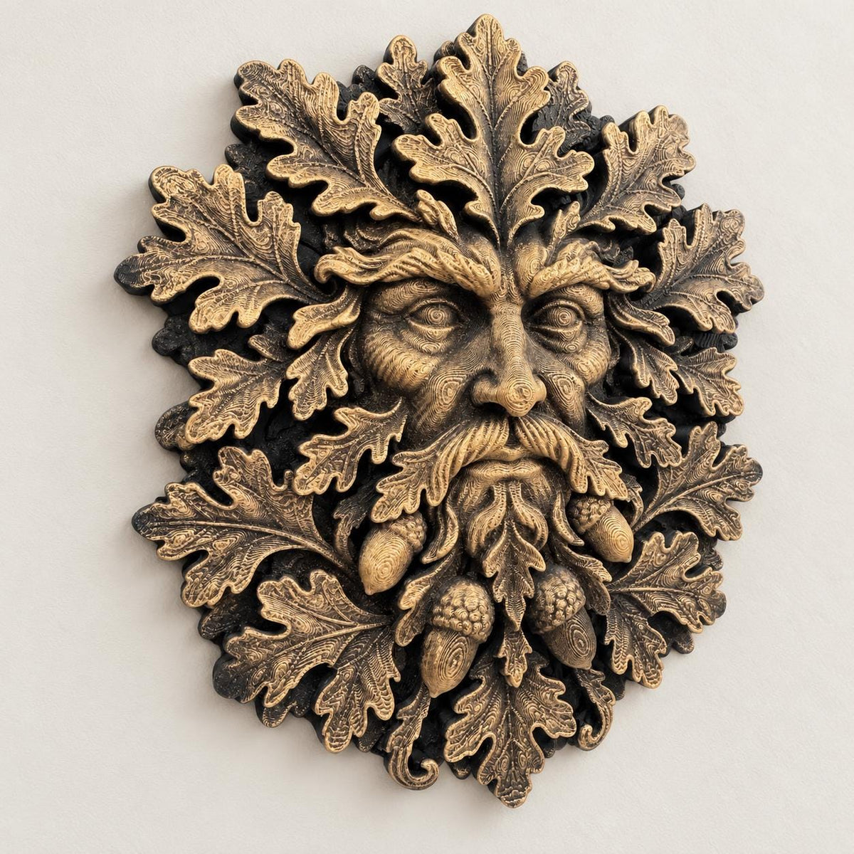 Close-up of sculpted oak leaves and acorns on the Green Man