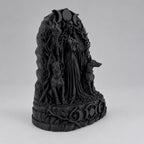 Side angle of the black Hecate statue showing hound and branch detail