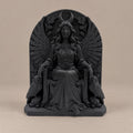 Front view of black Lilith goddess statue seated between two owls under a crescent moon