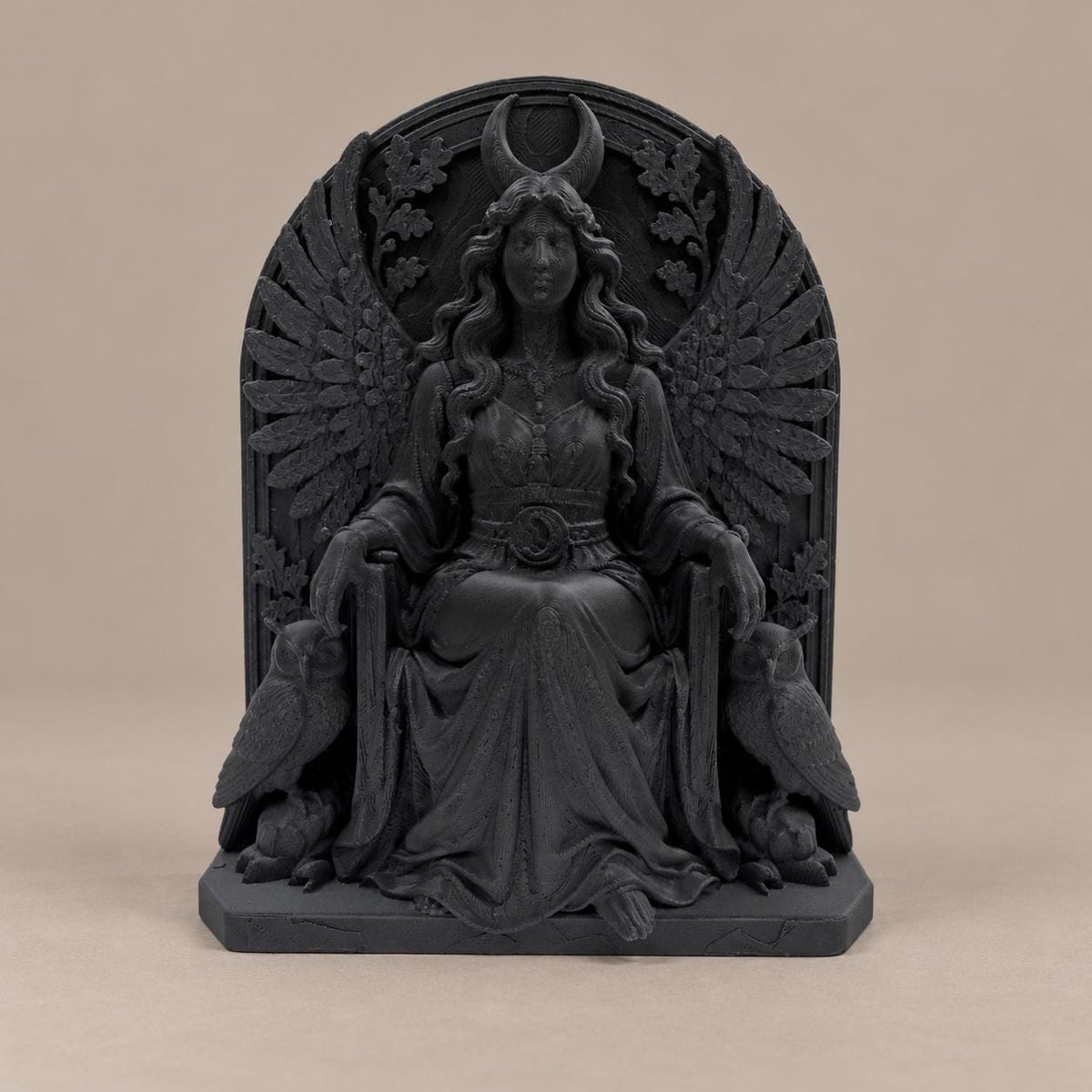 Front view of black Lilith goddess statue seated between two owls under a crescent moon