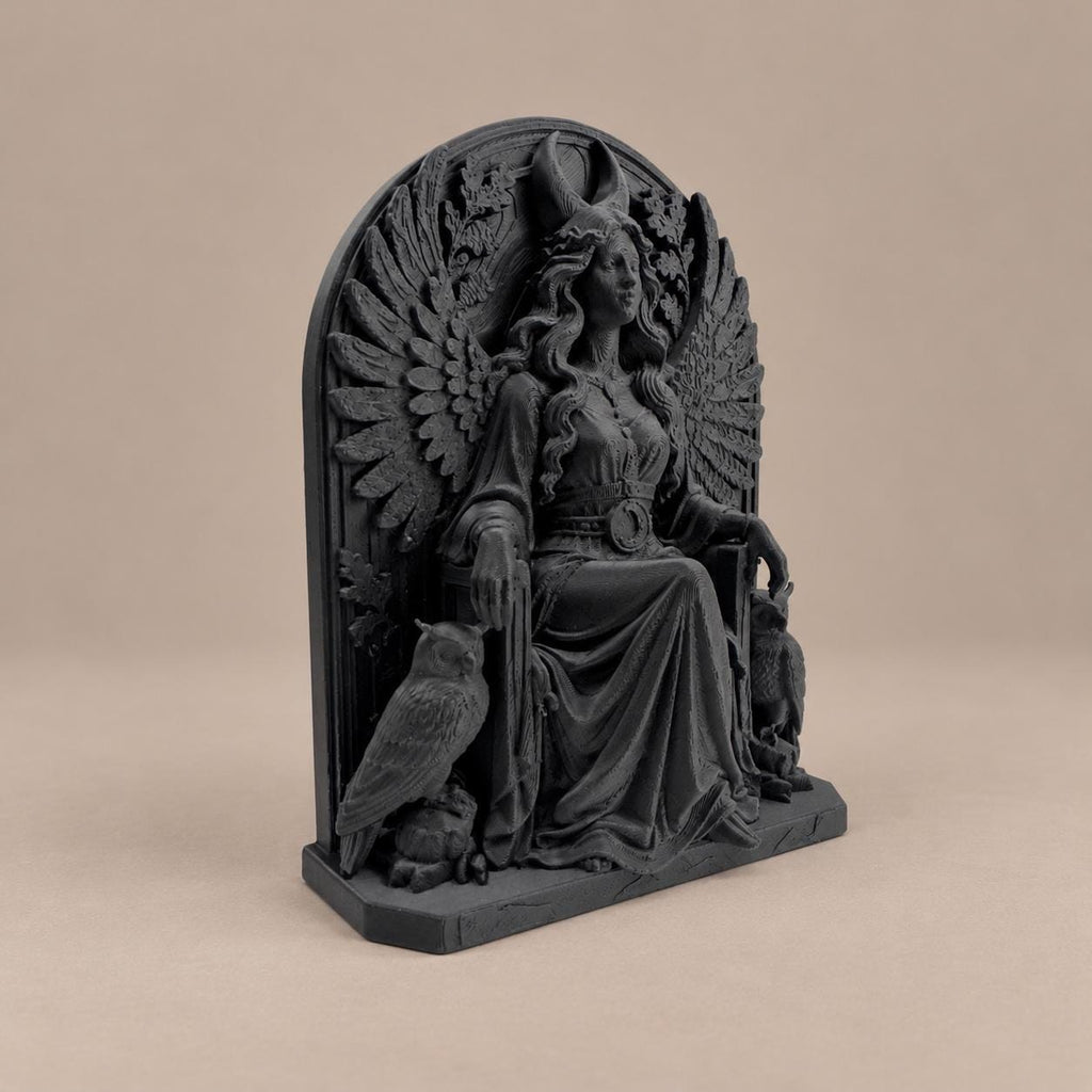 Left angle of the Lilith statue showing feathered wings and owl
