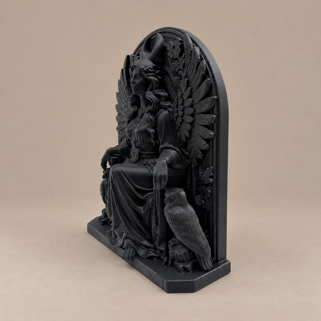 Right angle of the seated winged goddess statue showing depth