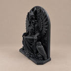 Right angle of the seated winged goddess statue showing depth