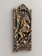 Right angle of the tarot Death relief showing the skeletal rider and banner