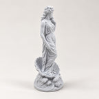 Aphrodite statue displayed as bookshelf decor